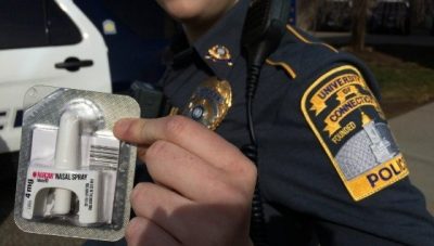 Police officer carrying Narcan
